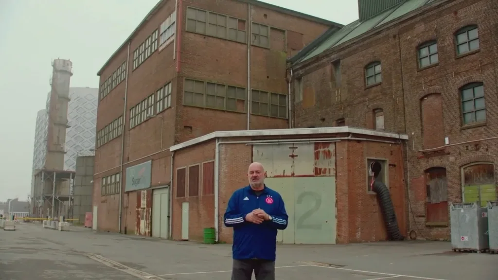 Werner Vogels standing outside in front of a warehouse